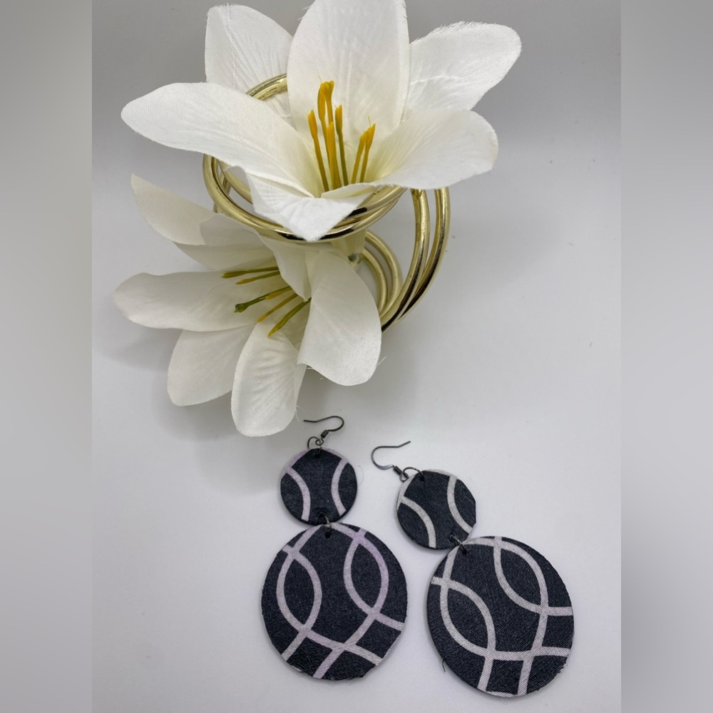 Black and white handcrafted wood with fabric.